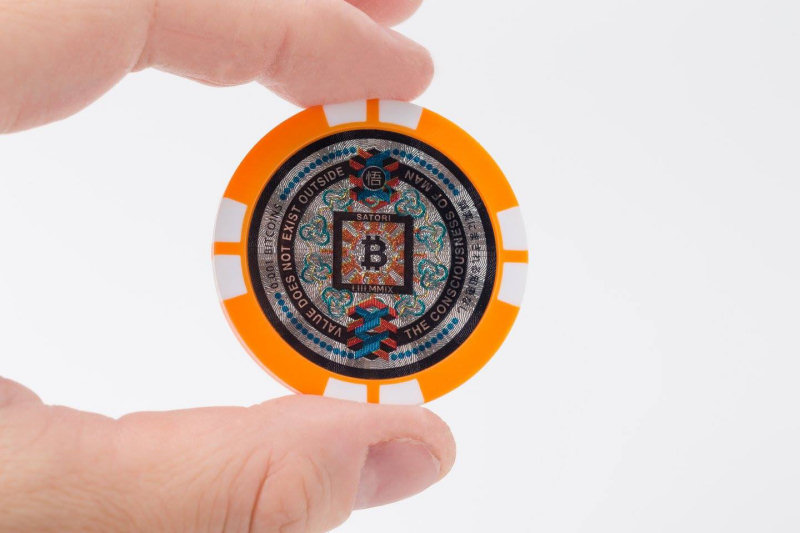 The front side of a Satori Coin
